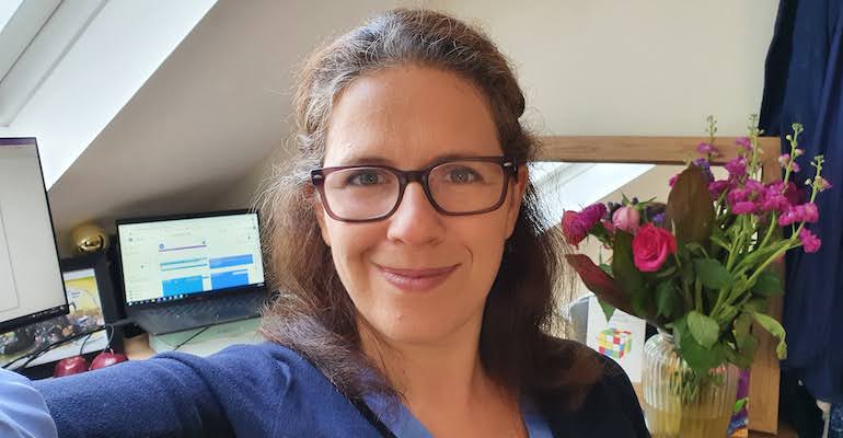 Image of EMBL-EBI staff member at her desk